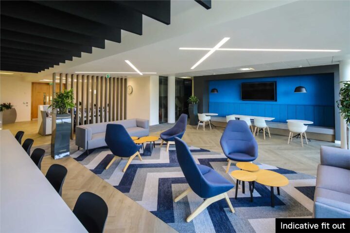 Modern office lounge with blue chairs, sofas, tables, and a TV on the wall; labeled